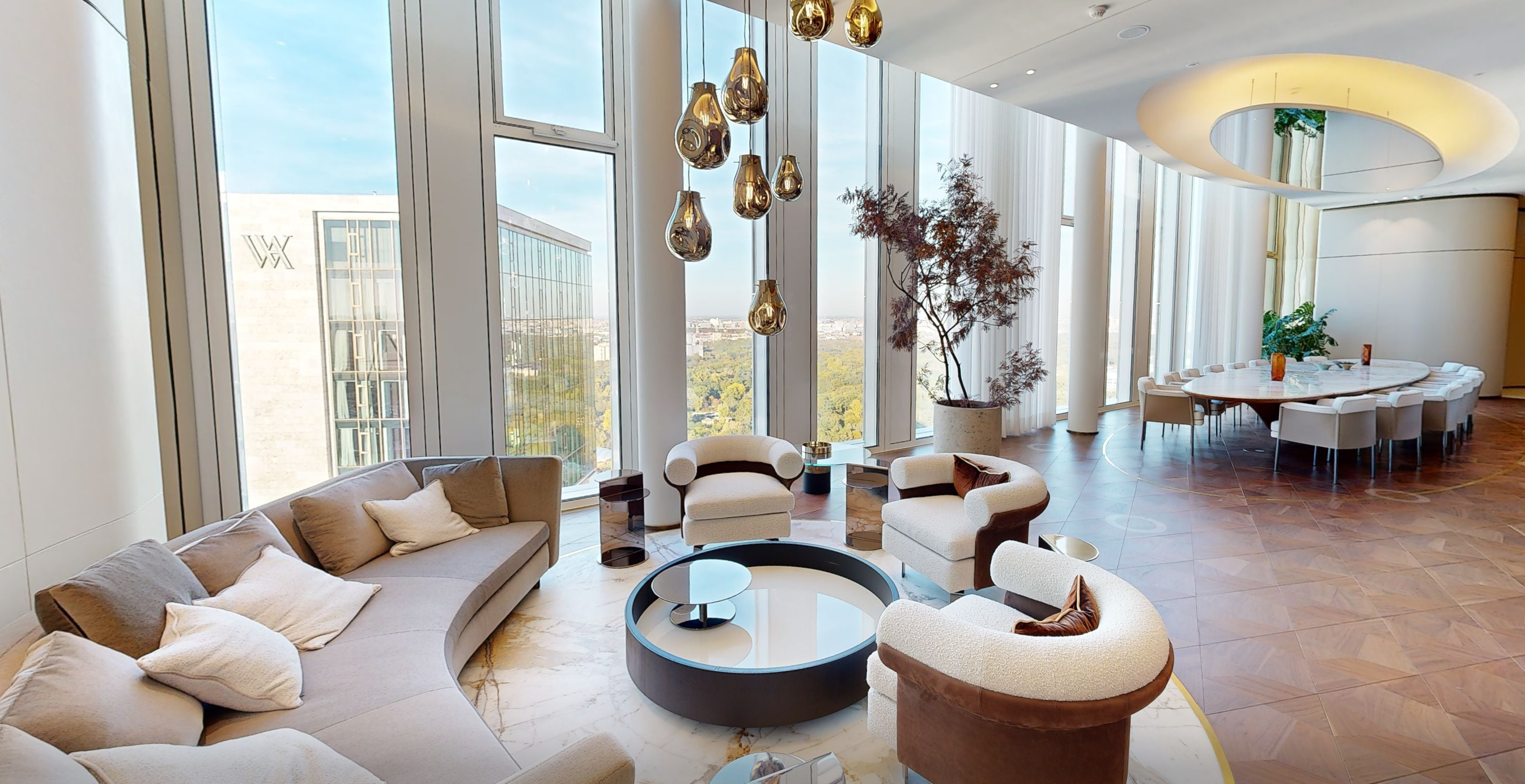 THE EMBER · Lounge with wine table and city view